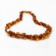 Collier d'ambre véritable couleur cognac, taille irrégulière