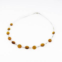 Collier d'ambre adulte couleur miel sur cable acier 
