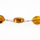 Collier d'ambre adulte couleur miel sur cable acier 