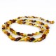 Collier long d'ambre pierre losange couleur miel, cognac et citron
